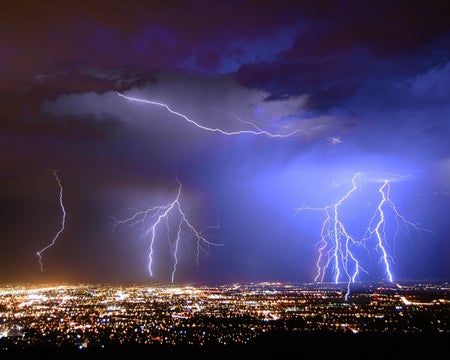 Purple ightning strikes over Albuquerque at night.