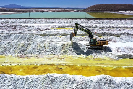 Aerial view of a lithium mine with vehicle