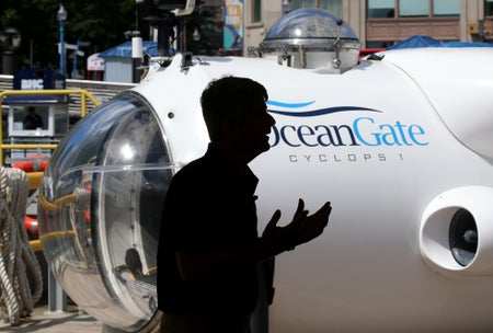 Stockton Rush, OceanGates chief executive, seen in silhouette as he spoke during a press conference in front of the Cyclops 1, a five-person sub that was used by OceanGate to capture detailed sonar images of the Andrea Doria shipwreck