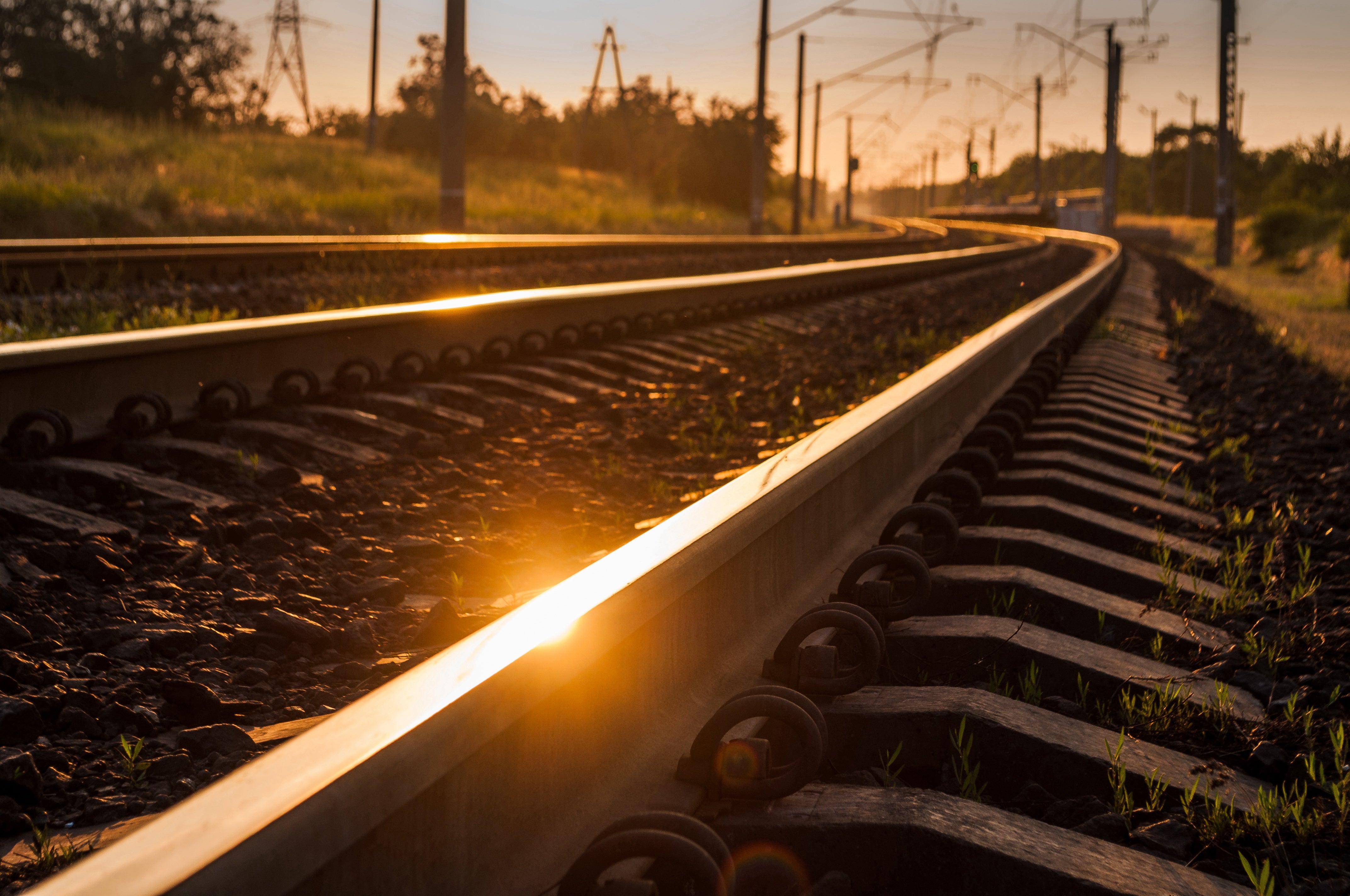 Sun reflecting in railroad tracks.