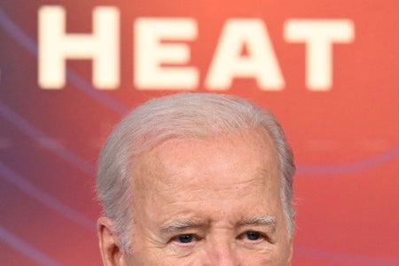 Face of Jo Biden with orange background and the word HEAT displaying in white letters