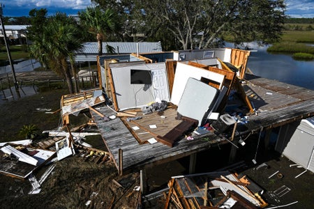 Interior of destroyed house on a platform.